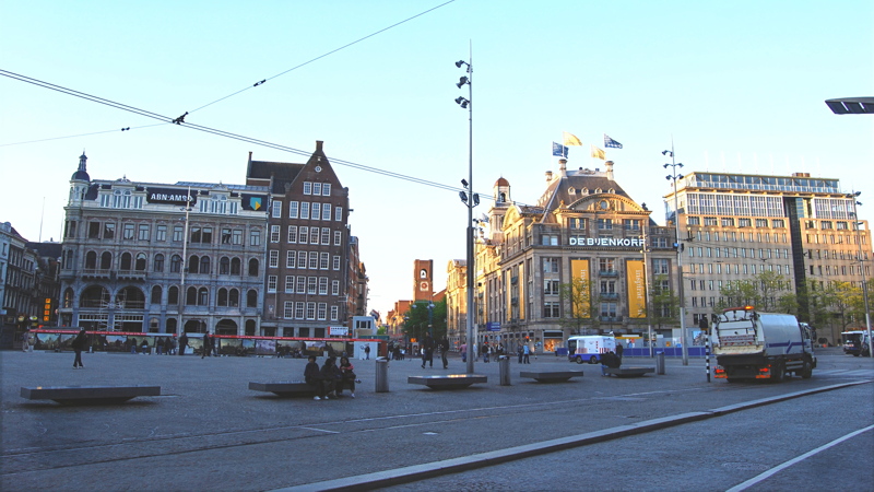 20 - The historic Dam Square in Amsterdam, featuring prominent Dutch architecture and cobblestone streets